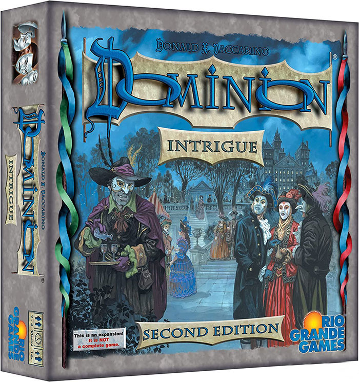 Strategy board game Dominion Intrigue second edition box featuring masked characters in a historical setting.
