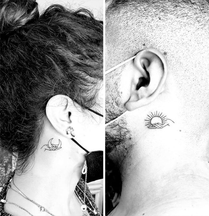 Brother and sister tattoos behind ears; moon and sun designs in minimal style.