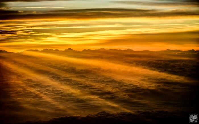 Sunrise Above The Clouds