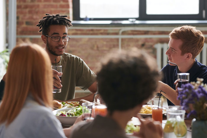 Friends eating and talking