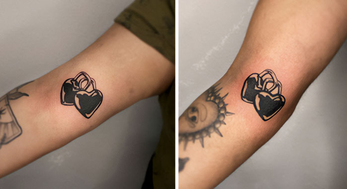 Small, simple brother and sister tattoos featuring linked black hearts on forearms.
