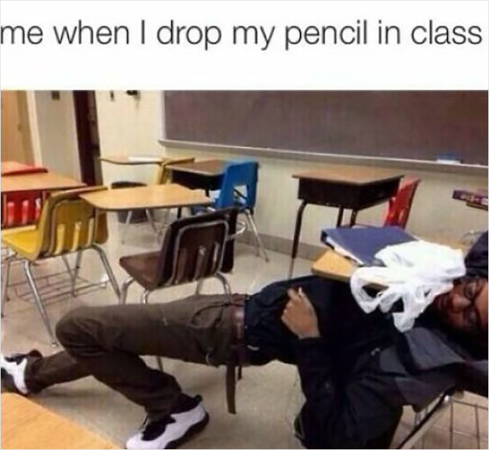 Student lying dramatically on classroom floor as part of a funny school meme about dropping a pencil.