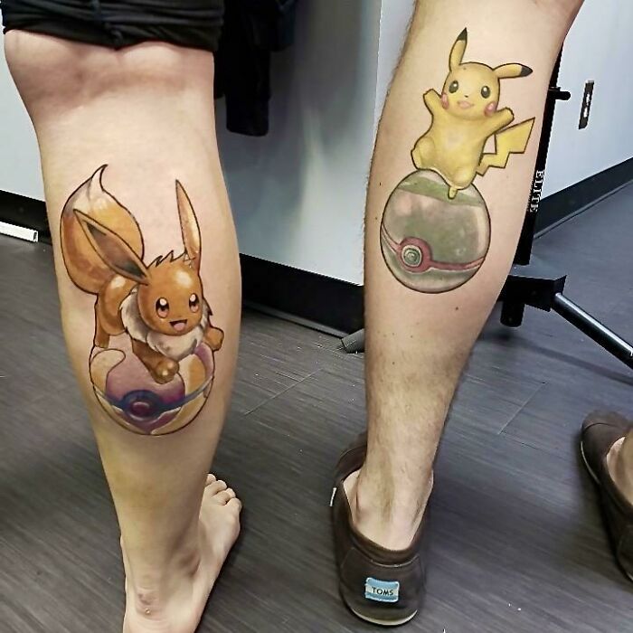 Matching best friend tattoos featuring Eevee and Pikachu on calves, showcasing a playful friendship theme.
