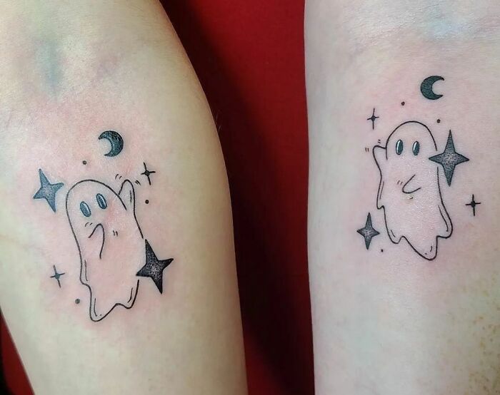 Matching ghost tattoos with stars and a crescent moon, symbolizing best friend tattoos for lasting friendship.