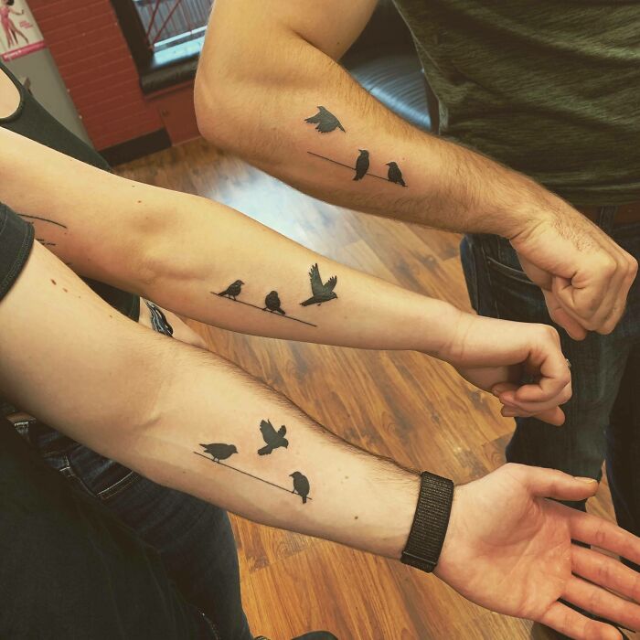 Sibling tattoos with small bird designs on three forearms, symbolizing brother and sister bond.