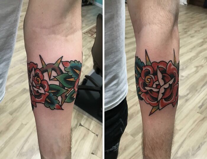 Colorful floral armband tattoo design with red roses and green leaves on the forearm.