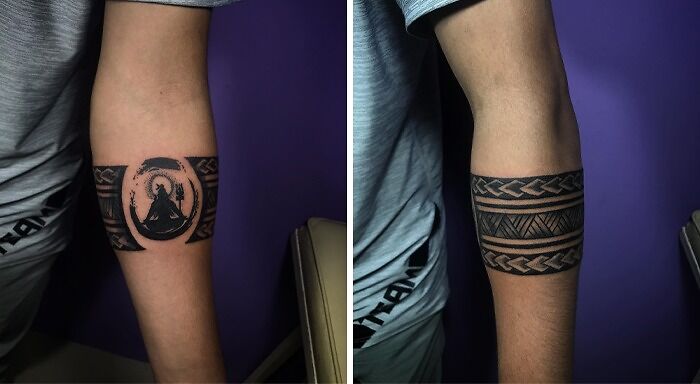 Intricate black armband tattoos with tribal designs on forearm.
