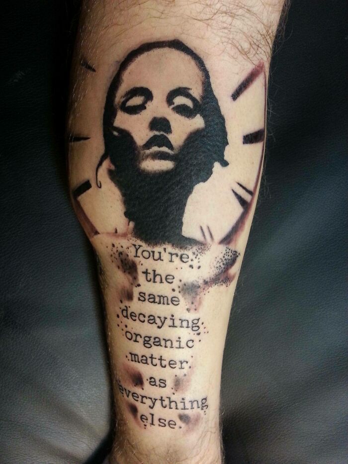 Creative word tattoo featuring a portrait and text about decaying organic matter.