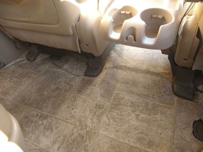 Even The Cupholder Is Frowning. Linoleum In A Minivan