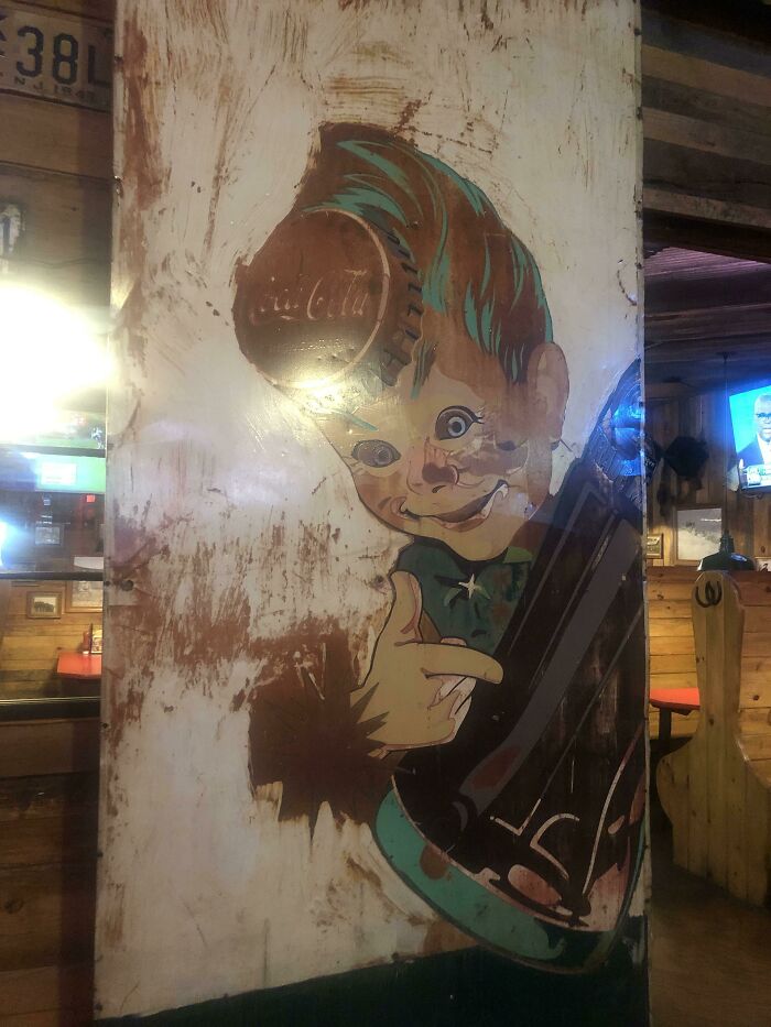 Bizarre Coca-Cola Sign At Buffalo Wild Wings