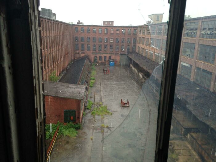 Giant Factory + Tin Roof + Pouring Rain = The Perfect Day