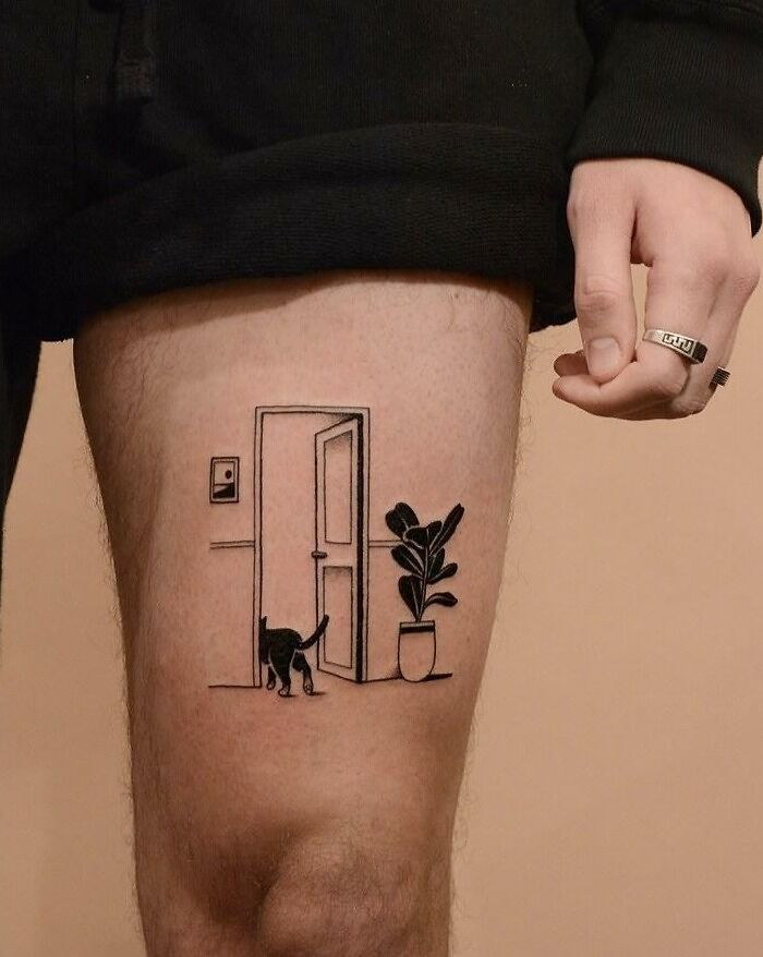 Pet tattoo on a thigh features a cat entering a room, symbolizing the bond between humans and their pets.