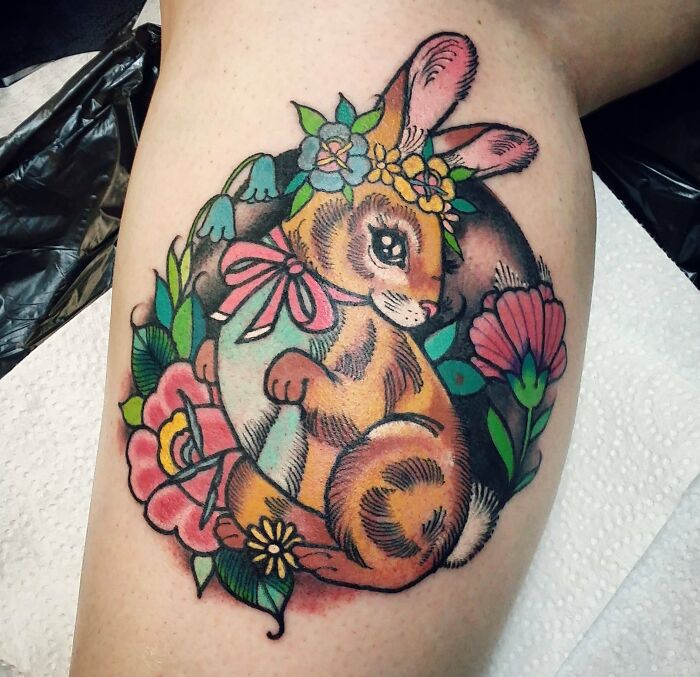 Colorful pet tattoo of a bunny with flowers, celebrating furry friends.