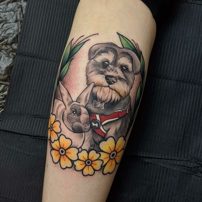 Pet tattoos depicting a dog and rabbit, surrounded by flowers, celebrating furry friends.