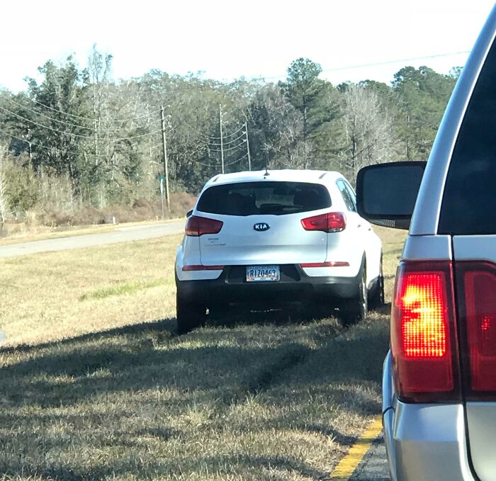 This Lady Decided To Try And Ride Through The Median To Avoid A Traffic Jam. Only Two Problems: She Has A Front Wheel Drive Crossover And It’s Been Raining For 3 Days