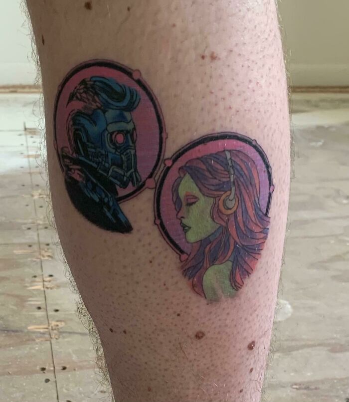 Marvel tattoo featuring two characters, one with a helmet and the other with green skin and headphones, on a person's leg.