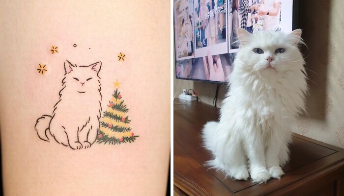 Pet tattoo of a white cat with a Christmas tree, alongside a real fluffy white cat sitting on a table.