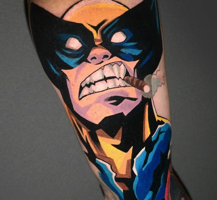 Marvel tattoo of a fierce superhero in a comic art style with a cigar, showcasing bold colors and sharp details.