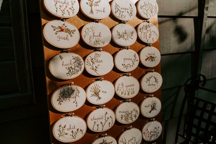 My Favorite Detail From Our 9/28 Wedding: I Made Embroidery Hoops For Favors And All Of Them Say A Variety Of Mean/Rude/Curse Words