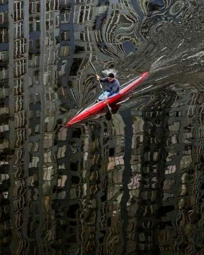 The Reflection Of Buildings On The Water Paddled