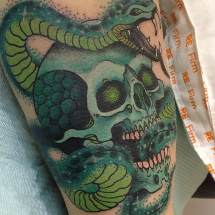 Green skull and snake tattoo inspired by the Wizarding World for devoted Harry Potter fans.