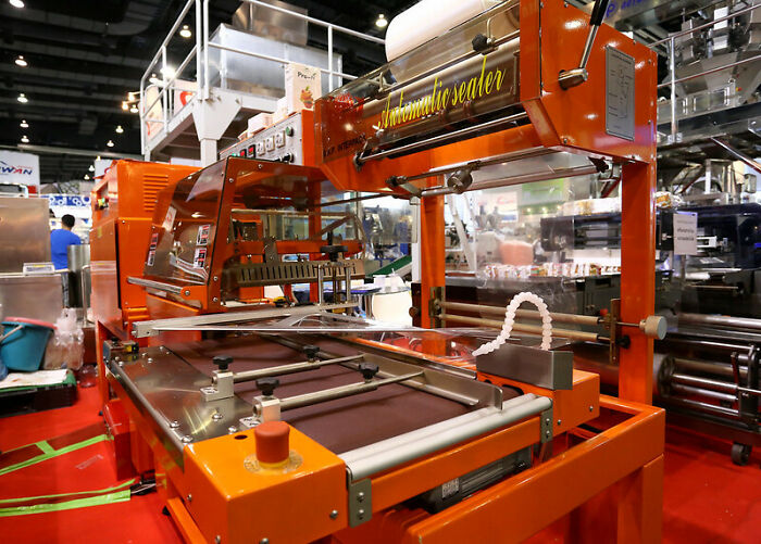 Industrial automatic sealer machine in a manufacturing setting showcasing equipment that doesn’t work like that stories.