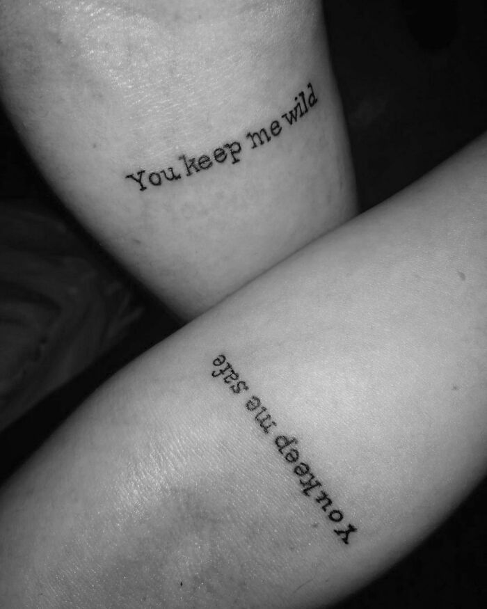 Brother and sister tattoos saying "You keep me wild" and "You keep me safe" on forearms, symbolizing deep connection.