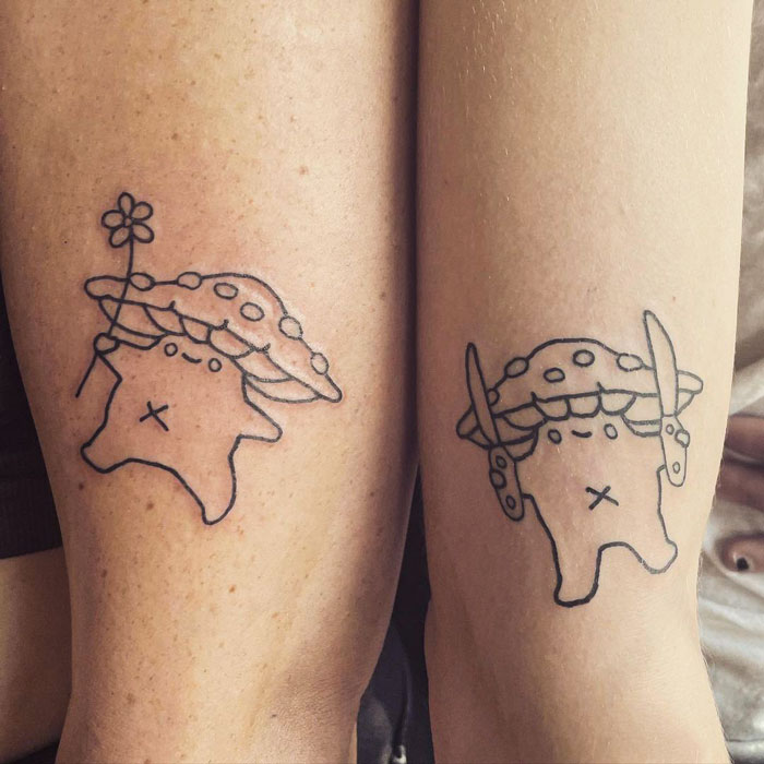 Matching BFF tattoos of cute characters with mushroom hats on forearms.
