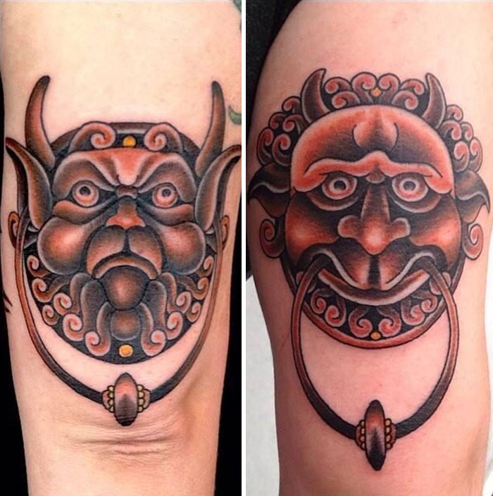 Matching best friend tattoos featuring intricate, mythical masks in vibrant colors, symbolizing friendship.