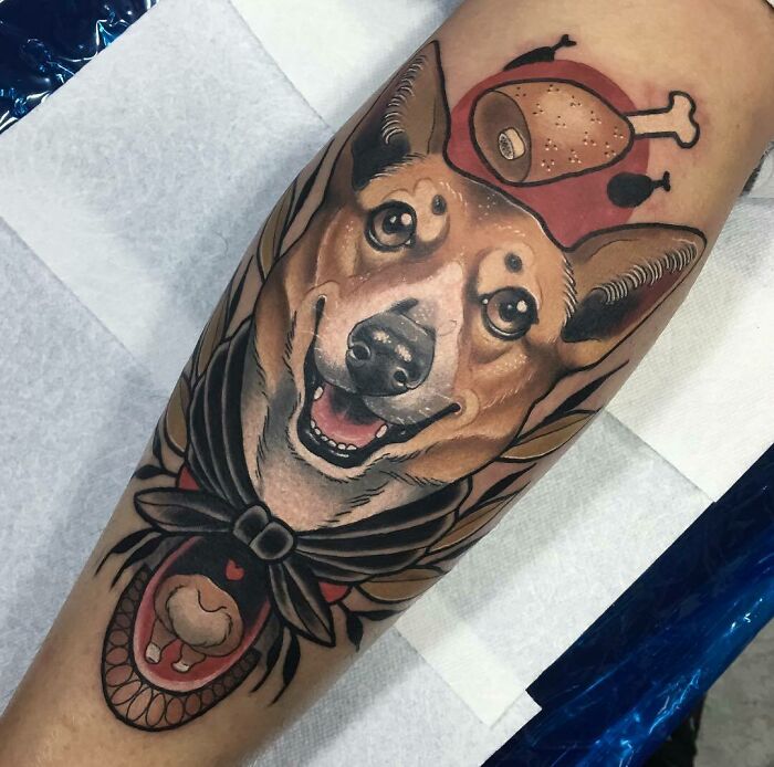 Pet tattoo showcasing a dog's happy face with food elements on the arm.