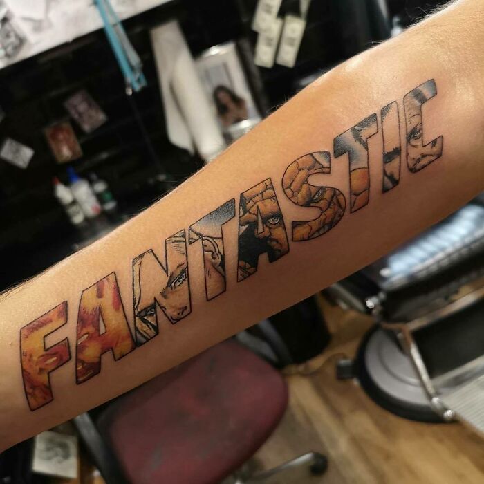 Arm tattoo spelling "FANTASTIC" with Marvel character designs, highlighting cool Marvel tattoos in a tattoo studio.