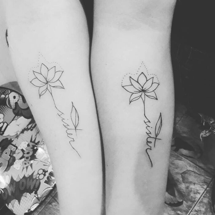 Brother and sister tattoos of matching lotus flowers with the word "sister" on forearms.