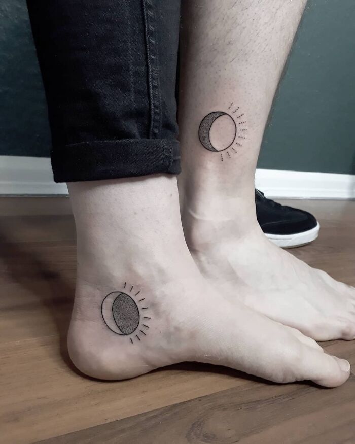 Brother and sister showing matching crescent moon tattoos on their ankles.