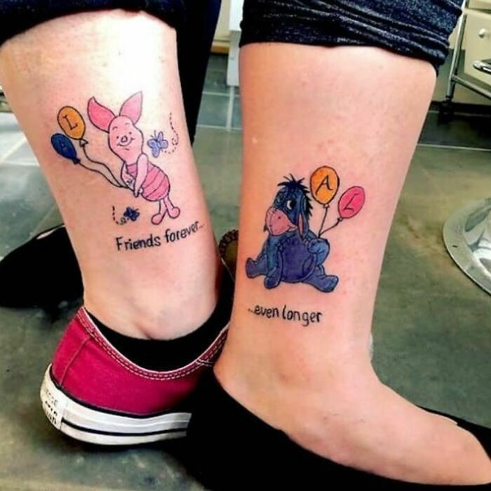 Best friend tattoos featuring Piglet and Eeyore with friendship messages and colorful balloons on legs.