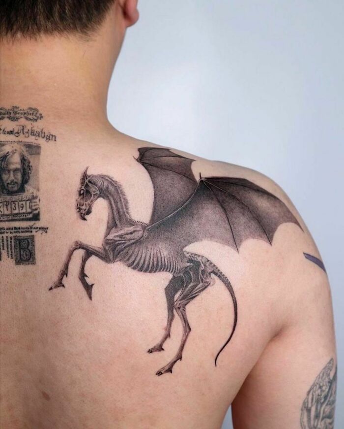 Shoulder tattoo of a Thestral from Harry Potter, showcasing intricate details for fans of the Wizarding World.