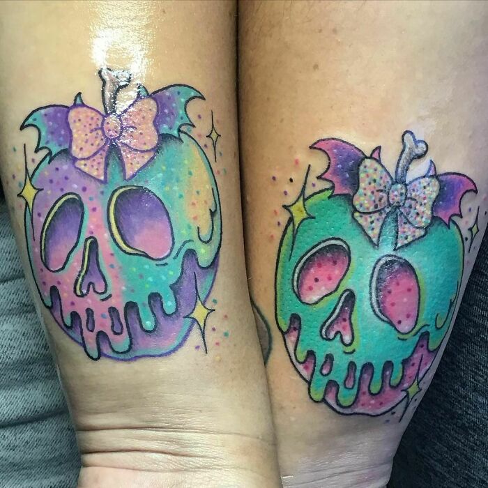 Colorful skull best friend tattoos with bows and bat wings.