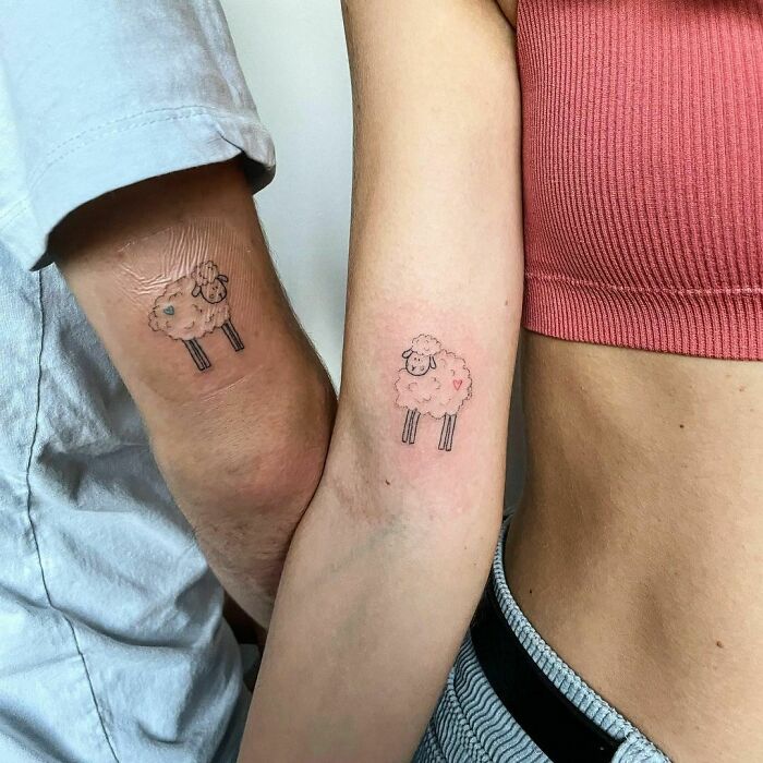 Brother and sister display matching small sheep tattoos on their arms, symbolizing kinship.