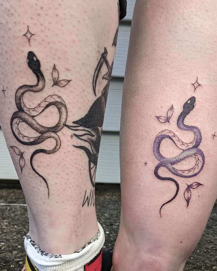 Snake BFF tattoos on calves, symbolizing friendship with matching designs.