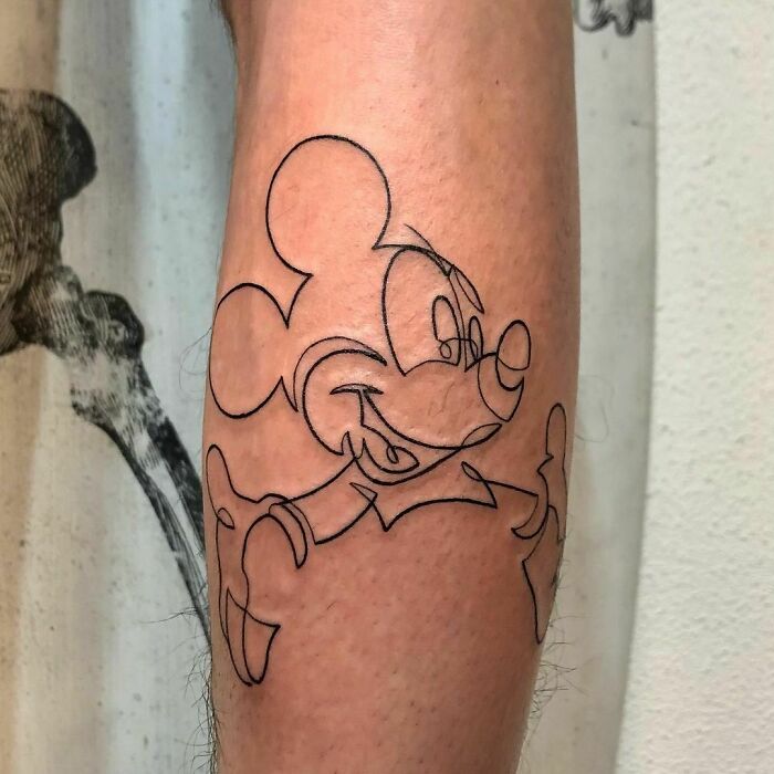 Minimalism line tattoo featuring a popular cartoon character design on a person's leg.
