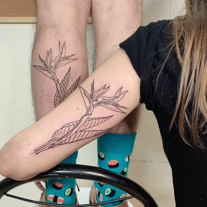 Brother and sister show matching plant tattoos, showcasing simple tattoo ideas for siblings.