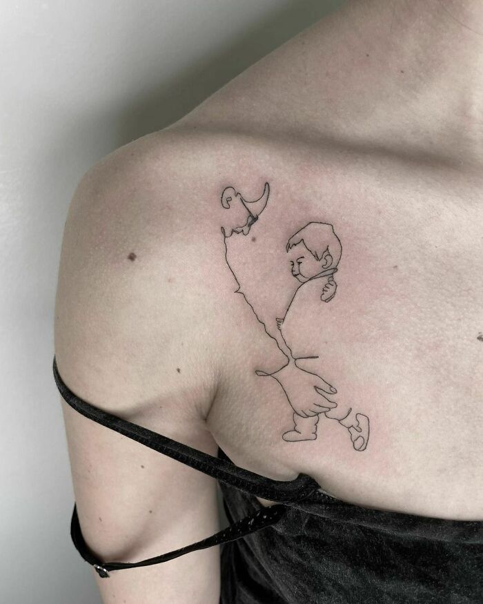 Fine-line single-line tattoo of a child being lifted by a person on the shoulder.