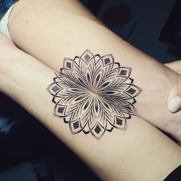 Intricate mandala tattoo on arms, symbolizing brother and sister bond with simple design.