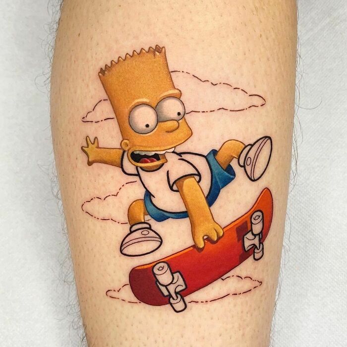 Cartoon tattoo of a yellow character Bart Simpson skateboarding with clouds in the background on a person's calf.