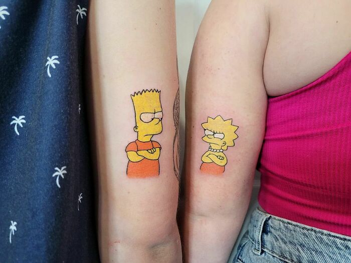 Brother and sister tattoos on arms featuring cartoon characters in matching poses.