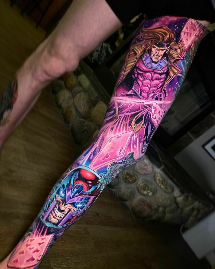 Colorful Marvel tattoo on leg featuring superheroes in a dynamic design.