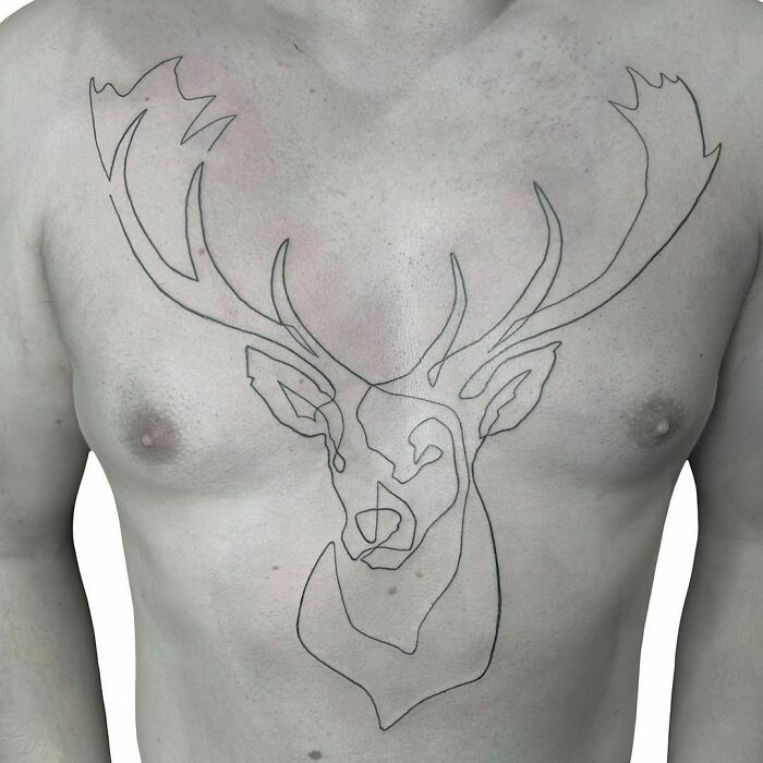 Minimalism line tattoo of a deer on a person's chest, showcasing unique design elements.