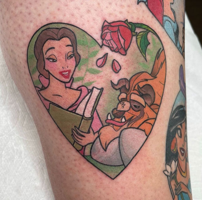Cartoon tattoo of classic characters in a heart shape, illustrating a nostalgic scene with a rose at the top.