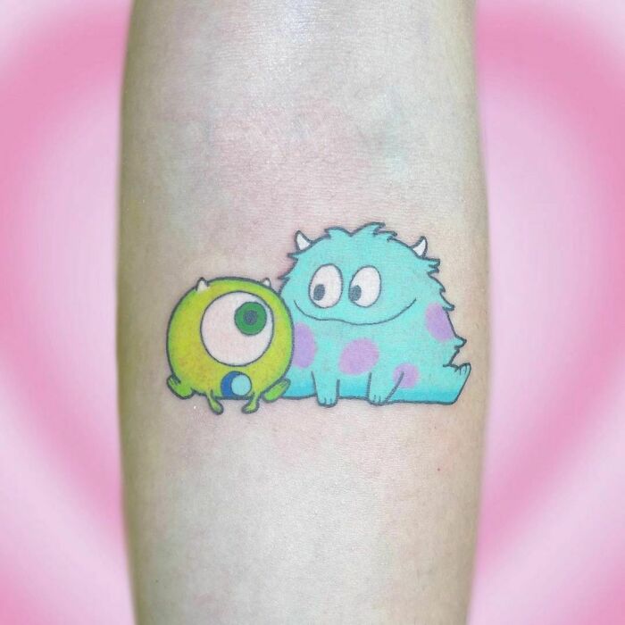 Baby Mike Wazowski and James P. Sullivan tattoo, embodying cartoon nostalgia.