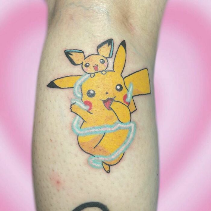 Cartoon tattoo featuring Pikachu and Pichu, capturing childhood favorites with vibrant colors on a skin canvas.