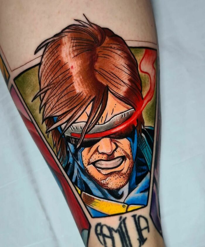 Vibrant Marvel tattoo featuring a superhero Cyclops with red visor and vivid colors, capturing comic book style.